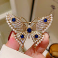 Small Pearls Surround Blue Diamonds Embellished with Full